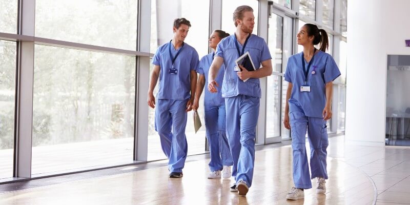 Nurses Walking Through Hospital